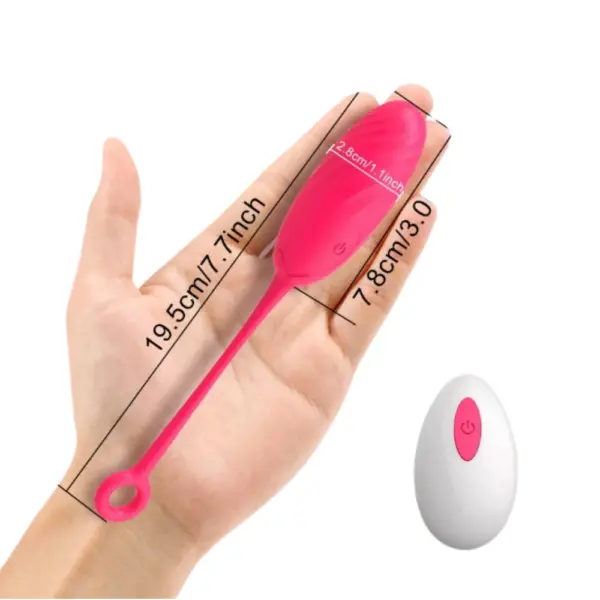 Pink Wireless Egg Vibrator – BlushPop held in hand with size dimensions labeled as 7.8 cm by 2.8 cm for the body and 19.5 cm total including the tail.