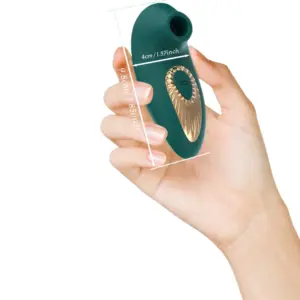 Suction Sex Toy – ThePeacock held in a hand showing scale, with dimensions labeled at 9.8 cm long and 4 cm wide for compact use.