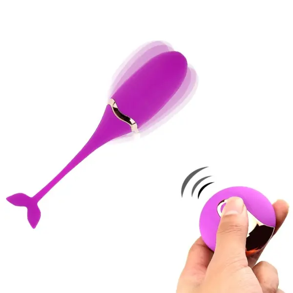 Remote Vibrating Egg Toy – Playette depicted in use with remote control in hand, showing the egg vibrating and the flexible tail in motion.