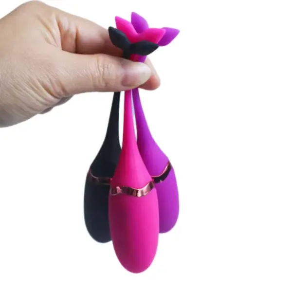 Remote Vibrating Egg Toy – Playette shown in three colors held by a hand from the flexible tails, highlighting their lightweight, portable design.