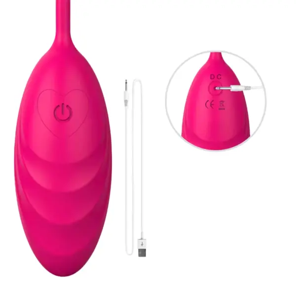 Quiet Egg Vibrator – MuteMuse shown with its USB charging cable and a close-up of the heart-outlined power button at the base of the pink silicone egg.
