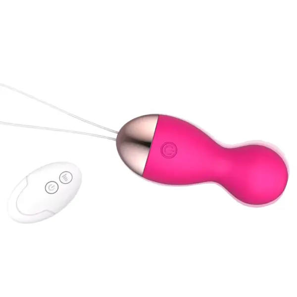 A bold pink Heated Egg Vibrator – WarmBlush with white wireless remote control, highlighting the long retrieval cord and simple interface.
