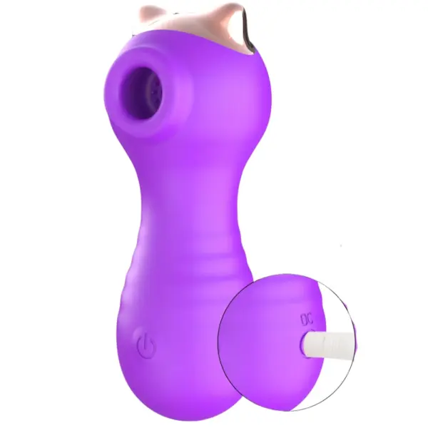 Air Pulse Vibrator – Aerella shown with its USB charging cable plugged into the back, highlighting its smooth silicone finish and ergonomic power button.