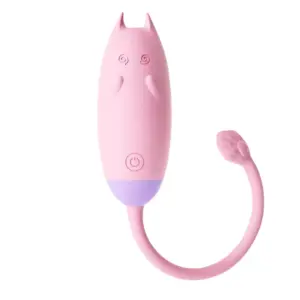 A pastel pink Remote Control Kitty Love Egg – PurrVibes with a playful cat-ear shape, raised swirl eyes, and a flexible paw-shaped tail for targeted stimulation.