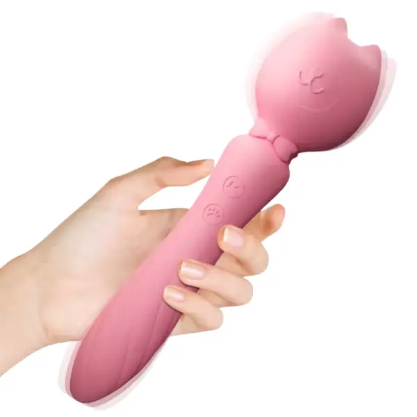 Personal Wand Massager – PurrPlay in motion while held in hand, showing button placement and gentle vibration waves around the rounded cat head, and the insertable bottom.