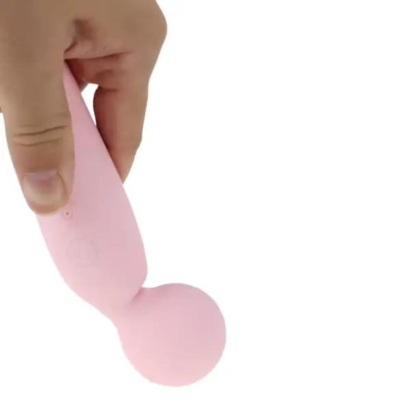 The Silicone Wand Vibrator - Velvet Lure being held in hand, highlighting its ergonomic design and soft-touch silicone finish