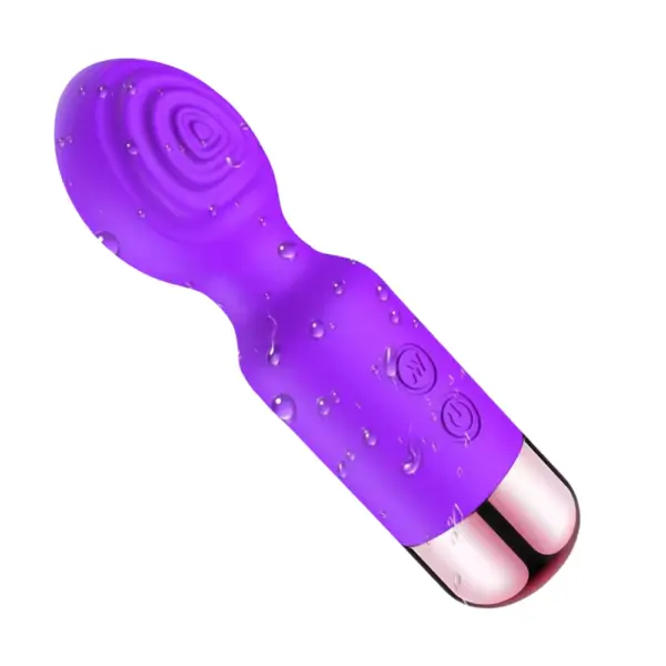 Purple Mini Rechargeable Wand – Flickette shown with water droplets on the silicone surface, highlighting its water-resistant build and ergonomic design.