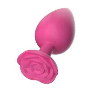 Small Butt Plug – TinyTush in vibrant pink with a smooth silicone body and a decorative rose-shaped base for playful elegance and safety.