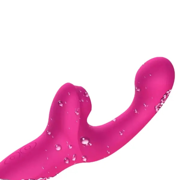 The pink Ergonomic Dildo With Suction Vibrator – Satin Rhythm covered in water droplets, emphasizing its waterproof silicone build and textured suction head.