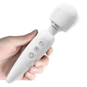 A hand grips the Quiet Wand Vibrator-Quiet Bliss, demonstrating the flexible neck’s smooth oscillation while the textured head quietly vibrates. This shot highlights the wand’s ergonomic profile and near-silent operation for discreet, precise massaging.