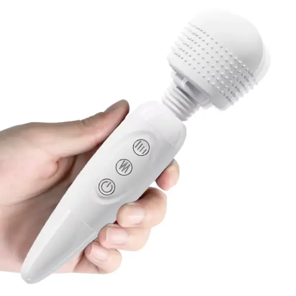 A hand grips the Quiet Wand Vibrator-Quiet Bliss, demonstrating the flexible neck’s smooth oscillation while the textured head quietly vibrates. This shot highlights the wand’s ergonomic profile and near-silent operation for discreet, precise massaging.
