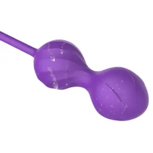 Purple Amivra Kegel egg shown with water droplets on its surface, highlighting its smooth silicone texture and water-resistant design.