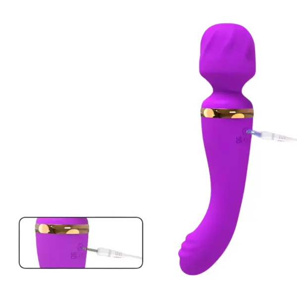 Amoria Wand Vibrator shown charging via a pin-style USB cable, with UKCA and CE marks visible above the charging port on the silicone surface.