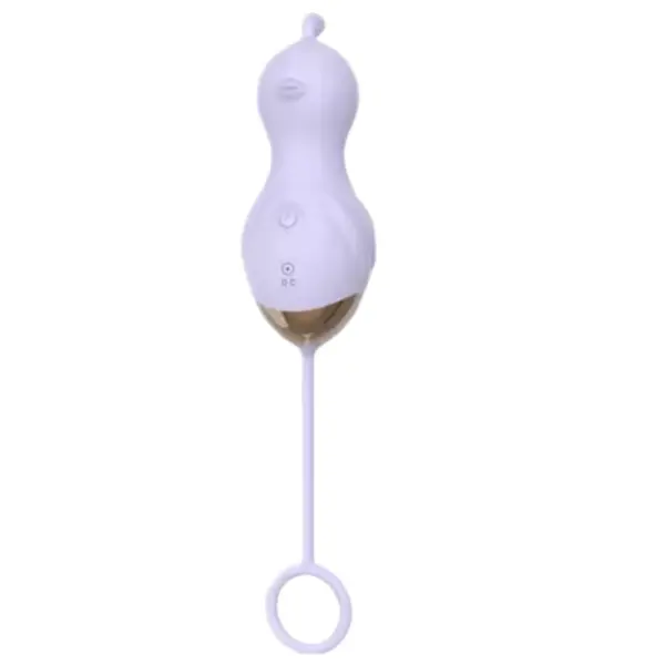 Front view of the Curvisa vibrator in pastel purple showing the wing-like detail, gold metallic base, and long silicone tail with ring loop.