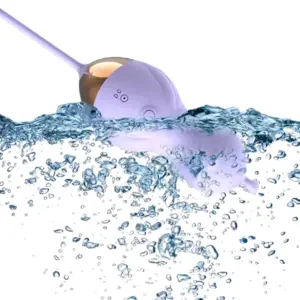 Curvisa vibrator partially submerged in water, showcasing its waterproof design and smooth, body-safe silicone casing in lavender with gold detail.