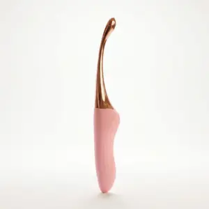 Beginner Friendly G-Spot Vibrator – FirstRipple features a slim, curved rose gold tip with a pink ergonomic handle designed for gentle, beginner-friendly internal stimulation.