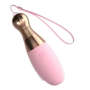 Angled shot of the Strikella vibrator showing its ergonomic shape, rose gold metallic detailing, and pink silicone wrist strap attached to the top.