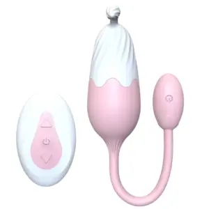The Thermavie silicone heated love egg in soft pink and white design shown with its matching remote control featuring simple buttons.