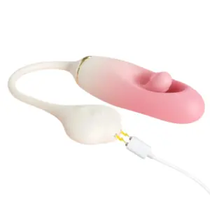 Side view of the Viorra vibrator connected to a magnetic charging cable, highlighting its seamless silicone finish and user-friendly power system.