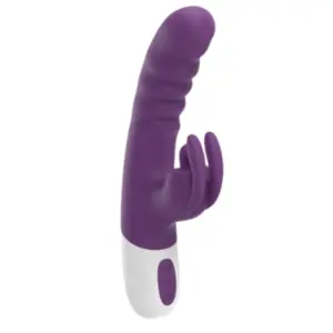 Rechargeable Rabbit with Flicker Tip – VoltBloom in deep purple silicone featuring a contoured, ribbed shaft and a flickering clitoral stimulator designed for rhythmic external pleasure.