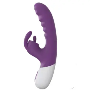VoltBloom vibrator shown from the side, highlighting its rippled shaft, split clitoral arm with flickering tip, and ergonomic curve for dual stimulation.
