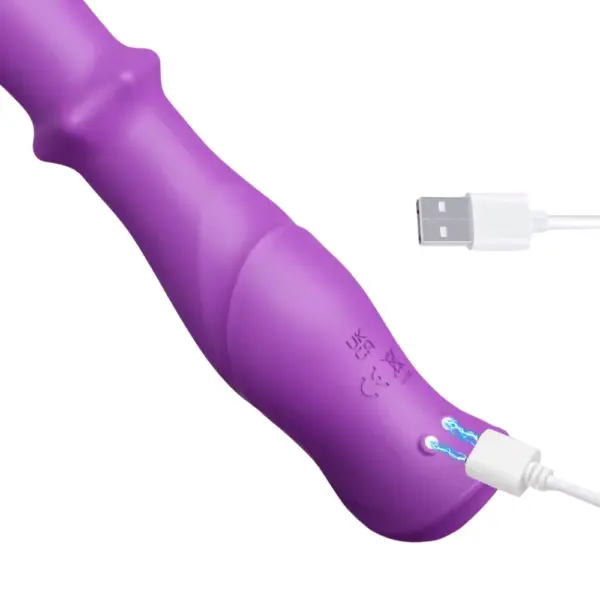 Close-up of the TriNova vibrator showing the magnetic USB charging port on its silicone surface, designed for convenience and waterproof sealing.
