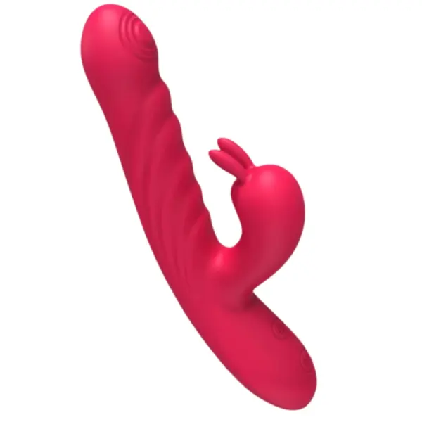 Close-up of the PlushPounce rabbit vibrator connected to a white USB charging cable, showing the power port and control buttons near the base.