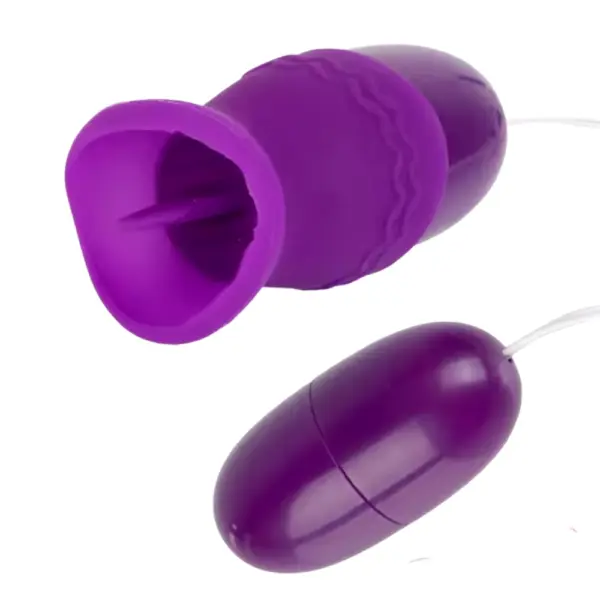 Close-up of the VibeLuxe dual egg vibrator in purple, highlighting the soft silicone attachment with an internal flicking tongue designed for clitoral stimulation.