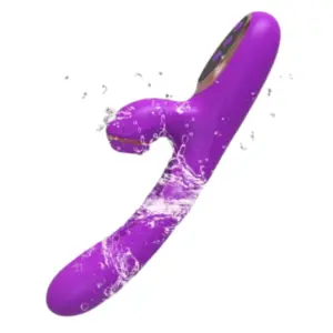 Water splashing over the purple Flika rabbit vibrator, emphasizing its waterproof design and ergonomic shape with curved shaft and clitoral suction zone.