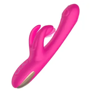 Bright pink DuoWhirl vibrator featuring a smooth curved shaft with tapping function and dual flexible bunny ears for external stimulation.