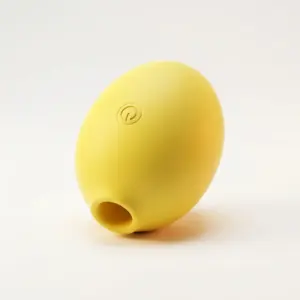 The Lemon Shaped Suction Vibrator from Citric Lust in a vibrant yellow finish, featuring a soft silicone body, oval shape, and suction opening at one end.