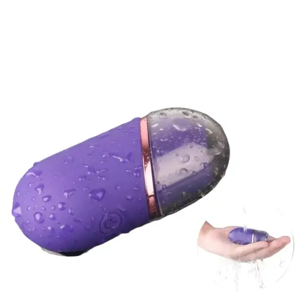 Mini clitoral suction stimulator – TinyTides shown covered in water droplets and being rinsed in a hand, demonstrating its waterproof design.
