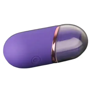 Mini clitoral suction stimulator – TinyTides laying flat with cap on, highlighting its discreet, capsule-like shape and soft-touch silicone finish.