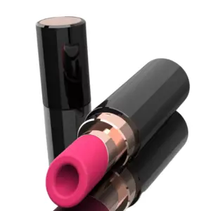 Lipstick clitoral suction vibrator – Smooché laying on its side with cap next to it, displaying the angled pink suction tip and glossy black casing.