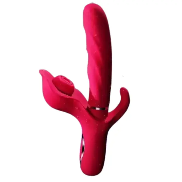 ThrustPetal rabbit vibrator shown in use-ready position with water droplets on the red silicone surface, emphasizing waterproof construction.