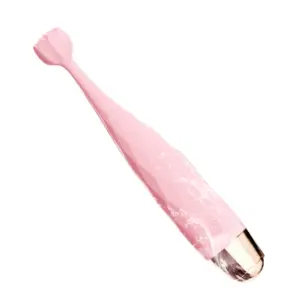 The HushBloom vibrator being rinsed, demonstrating its waterproof design and easy-to-clean textured surface with a soft silicone finish.