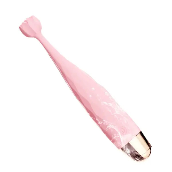 The HushBloom vibrator being rinsed, demonstrating its waterproof design and easy-to-clean textured surface with a soft silicone finish.
