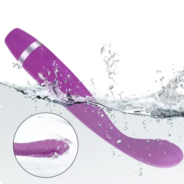 PlushGlow G-spot vibrator shown mid-splash to highlight its waterproof design, featuring a smooth curved shaft and ribbed tip for wet play compatibility.