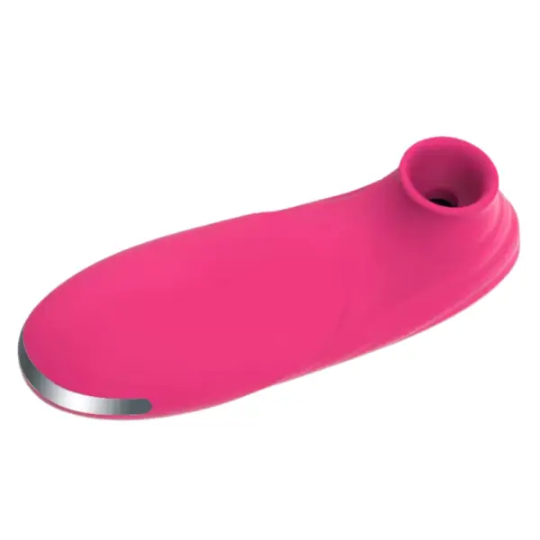 Suction Clitoral Vibrator – Plumora shown lying flat, highlighting the oval air-pulse nozzle and sleek contoured design for comfort during use.