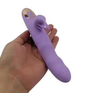 Lavender TapBun rabbit vibrator resting in hand, emphasizing compact size, tapping clitoral stimulator, and dual-button control at the base.