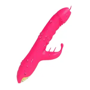 TwirlLuxe vibrator angled to display its waterproof silicone body covered in droplets, highlighting curved tongue attachments and gold-accented base.