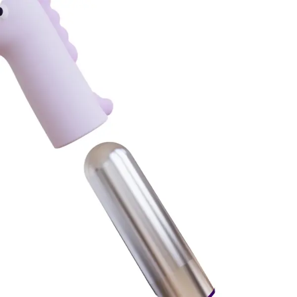 Unicorn shaped bullet vibrator – UniTease shown with the metallic bullet partially removed from the soft silicone unicorn sleeve for cleaning or use on its own.