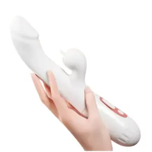 A hand holding the GlowWhisk heated vibrator, highlighting its full size and curved ergonomic design with external stimulator and control panel.