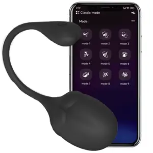 Black version of the BigBloom XL egg positioned in front of a smartphone showing its remote app features, highlighting hands-free smart control functionality.