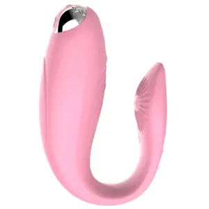 The Orvane Vibrator in soft blush pink, displaying its elegant silicone finish, ergonomic curve, and chrome detail near the control button.