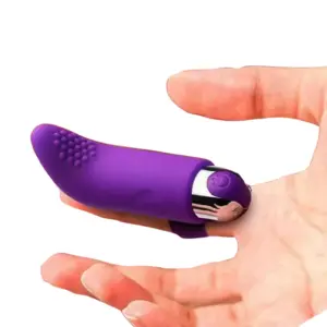 The Purvra Finger Vibrator fitted on an index finger, emphasizing its contoured shape and metallic bullet base for easy activation.