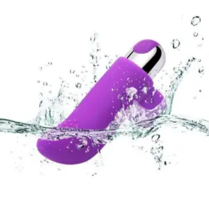 The Purvra Finger Vibrator captured mid-splash, demonstrating its waterproof design and durable silicone shell suitable for wet play.