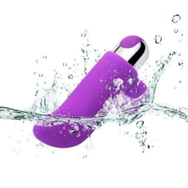 The Purvra Finger Vibrator captured mid-splash, demonstrating its waterproof design and durable silicone shell suitable for wet play.