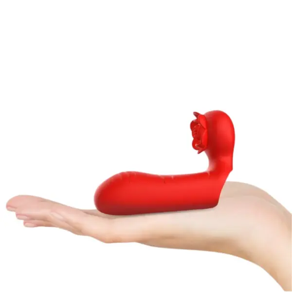 The compact Rosatra Dual Motor Finger Vibrator resting in a hand, illustrating its travel-friendly size and discreet, flower-inspired design.