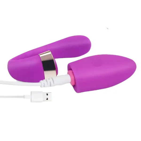 Close-up of the Veyora Vibrator in purple while charging via USB cable, highlighting the discreet charging port and seamless silicone body.